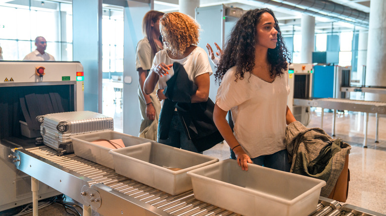 women going through airport security