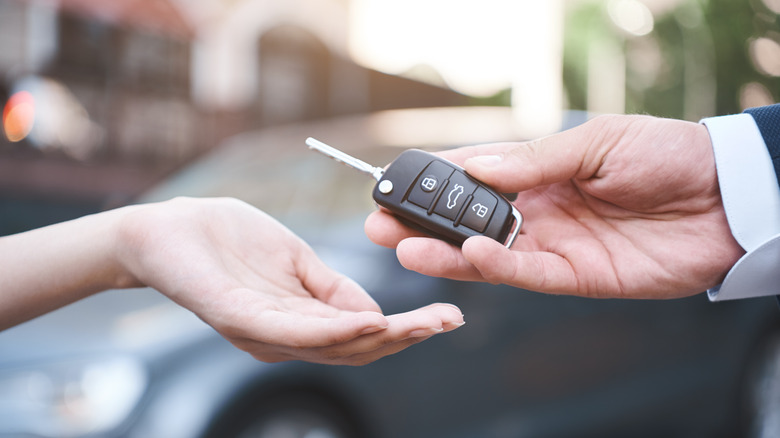 someone receiving rental car keys