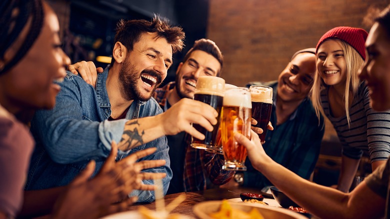 Friends toasting with beer