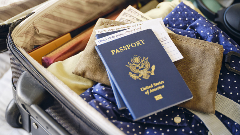 Passport and wallet in suitcase