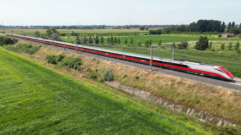 train crossing green countryside