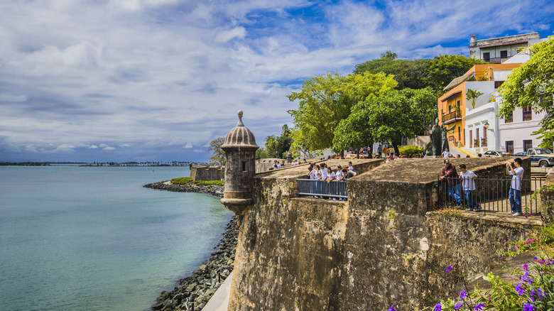 Travelers on San Juan's fortress wall