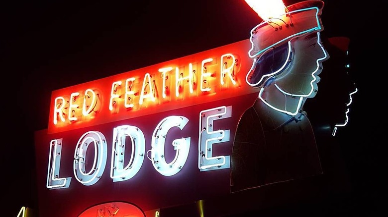 Red Feather Lodge sign at night