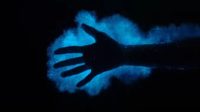 blue lit hand 