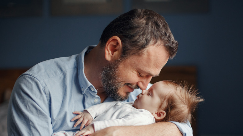 Father and his sleeping baby