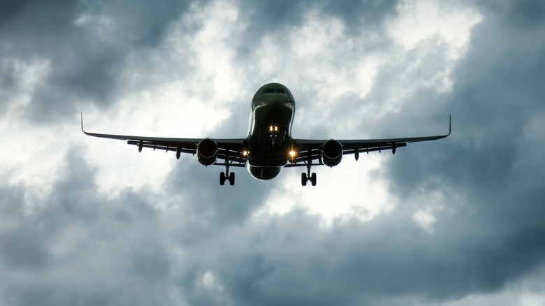 A Plane Flying Through Dark Clouds