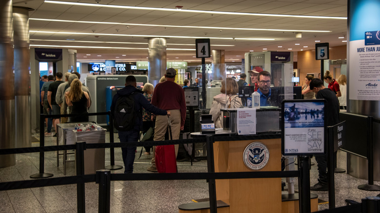 Passengers in line for airport security