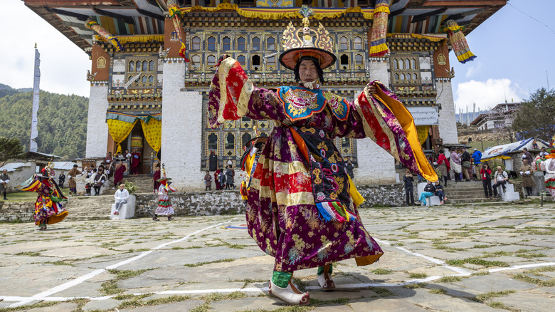 Bhutanese festive attire with temple