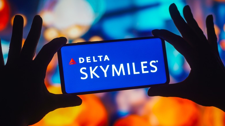 phone showing Delta SkyMiles logo