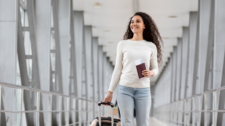 woman walking through airport