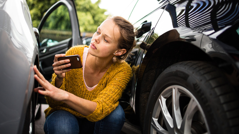 Traveler checking rental car