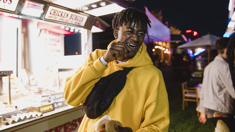 Man with fanny pack laughing