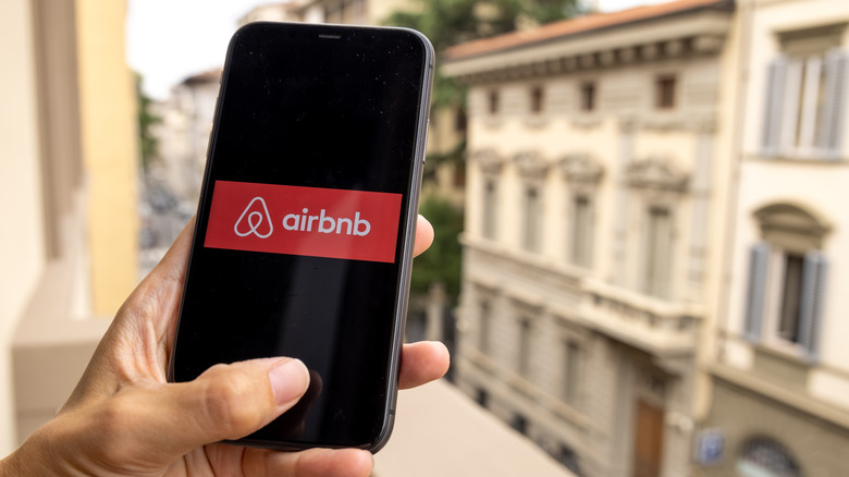 Person using AirBnb on phone