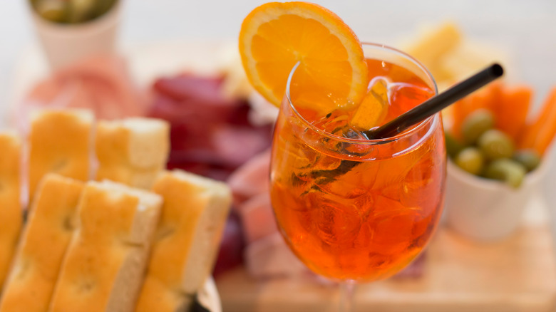 Spritz with bread, olives, and meat