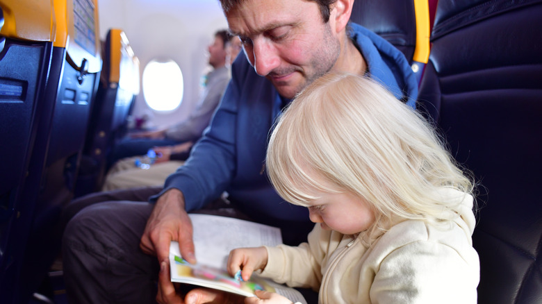 man and toddler on plane