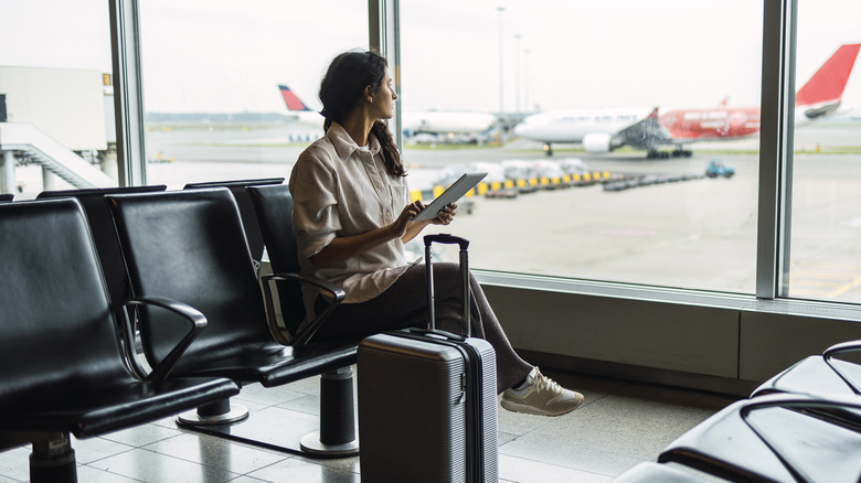 woman sitting in airport