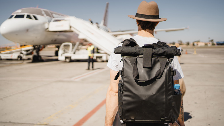 traveler walking to plane