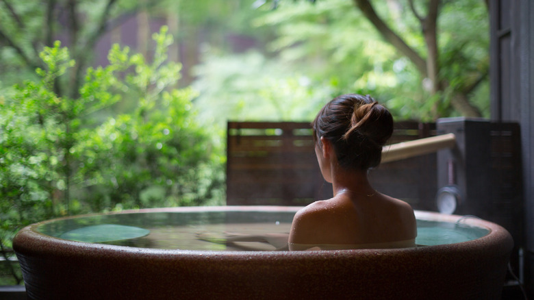 A woman soaking in an onsen in Japan