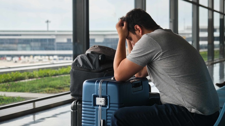 stressed man at airport