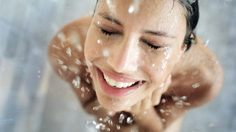 Woman happily showering