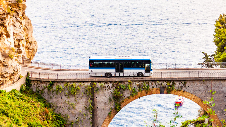 bus on scenic bridge over sea