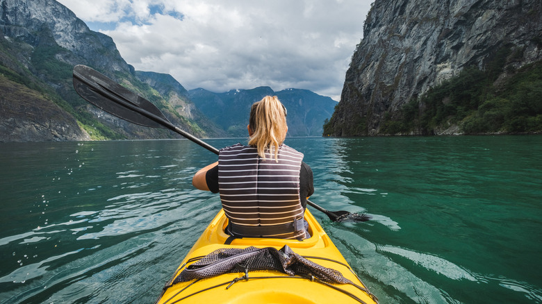 Woman kayaking in Norway