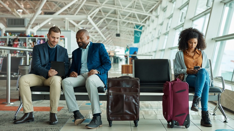 people sitting in airport terminal