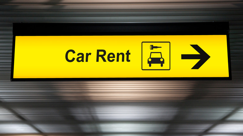 yellow car rent sign