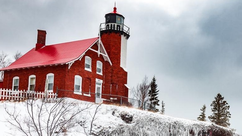 Red lighthouse icy bank