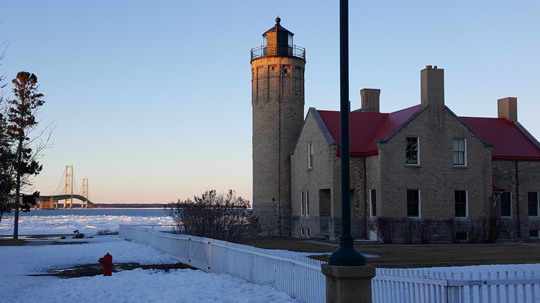 Snowy lighthouse Mackinac Bridge