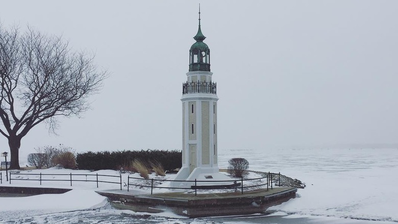 Lighthouse in frozen landscape