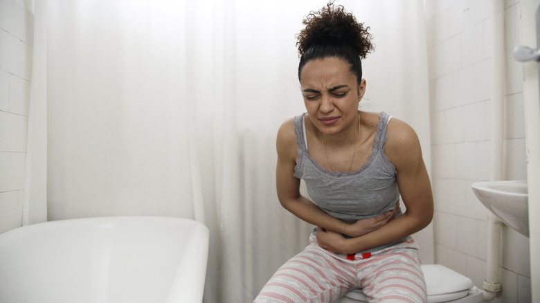 woman with upset stomach