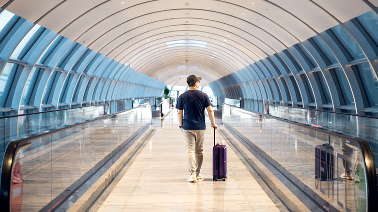 Man with suitcase in airport