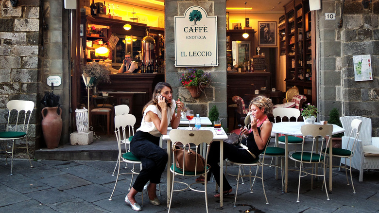 Women sitting at patio of enoteca