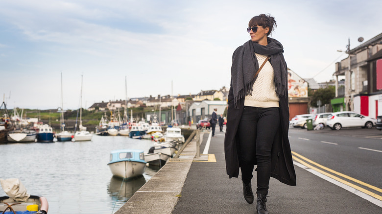 Woman in chic outfit walking