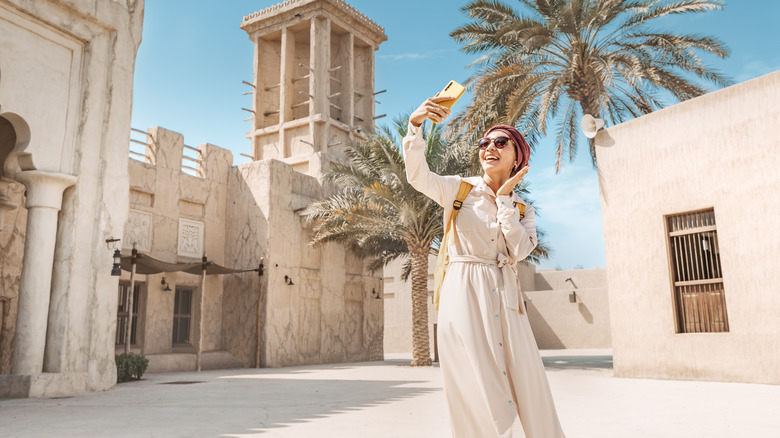 woman takes selfie in a Dubai square