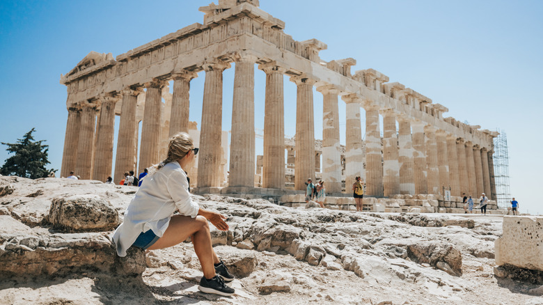 Traveler sitting nearby Parthenon