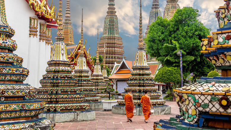 Monks walking inside Wat Pho