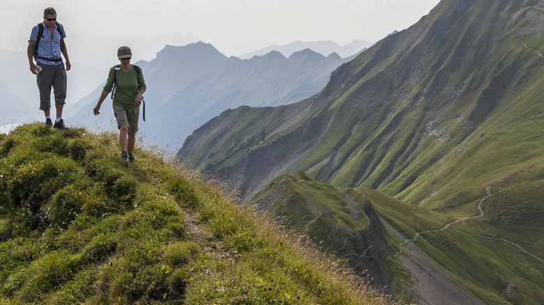 Couple hiking Swiss alps