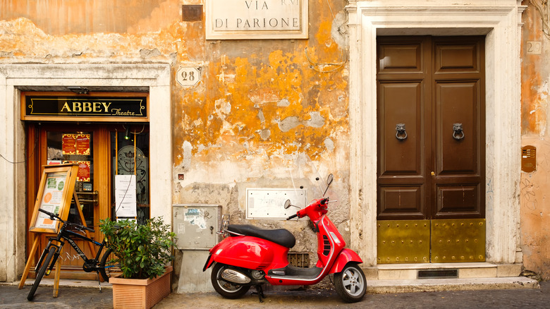 Red scooter on narrow street