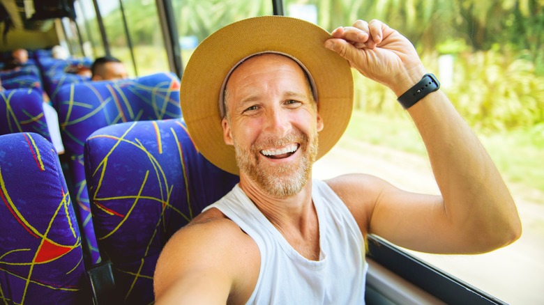 Smiling bus traveler