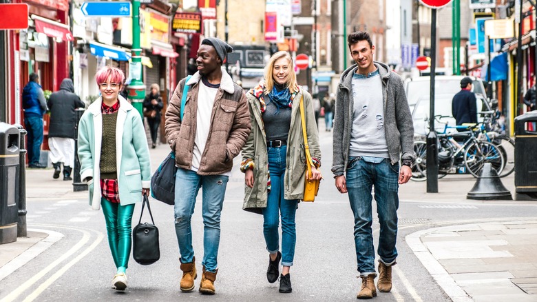 Four fashionable Londoners walking