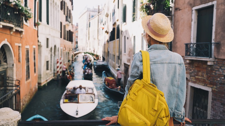 Traveler overlooking Venice canals