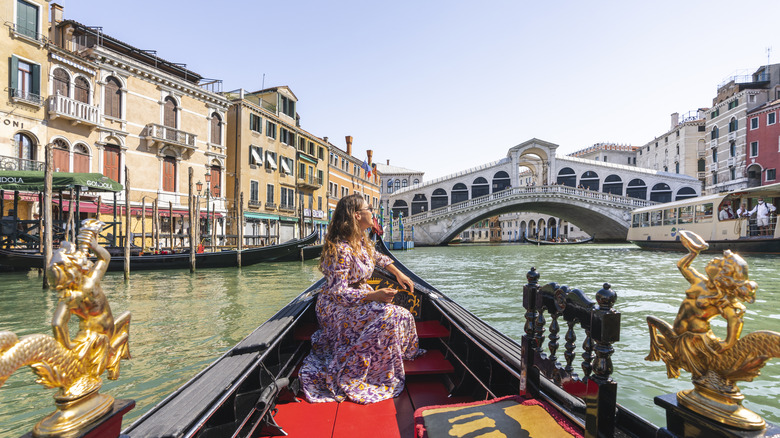 Young traveler riding gondola