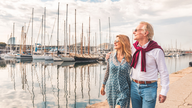 Couple walking along the port