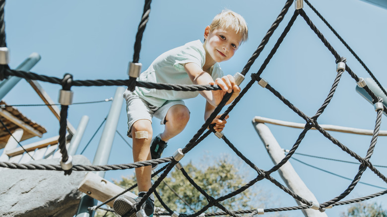 Boy climbing in a playground