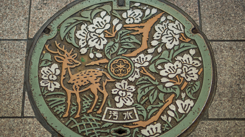 maintenance cover with deer-themed art