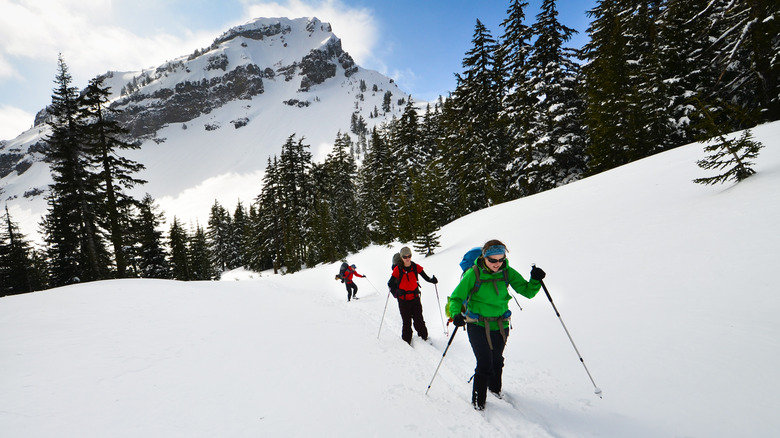 People skiing on the snowy Crater Lake