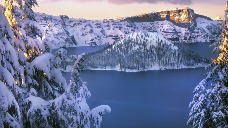 Deep blue lake with a snowy white volcanic bacdrop