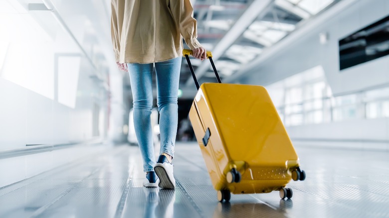 Woman with carry-on luggage